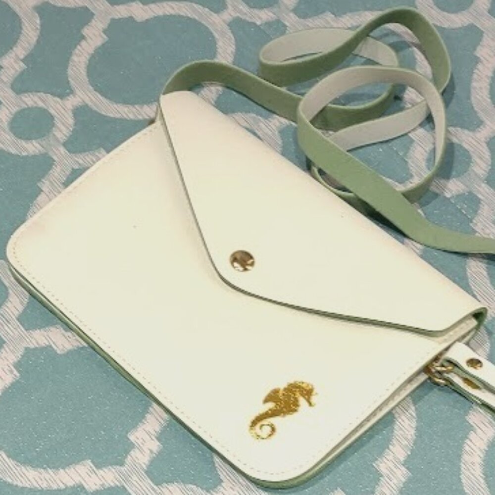 TOP IT OFF SMALL ENVELOPE PURSE  WRIST AND 21" SHOULDER STRAP 7 1/12 BY 5 1/2 IN